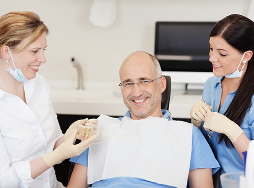 Dental team members providing full mouth reconstruction