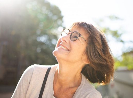 Lady smiles at the sun