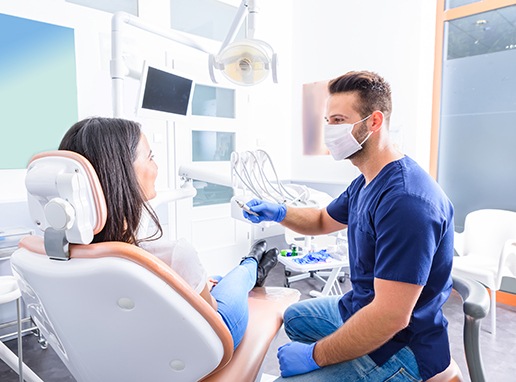 a dentist consulting with a patient about dental implants