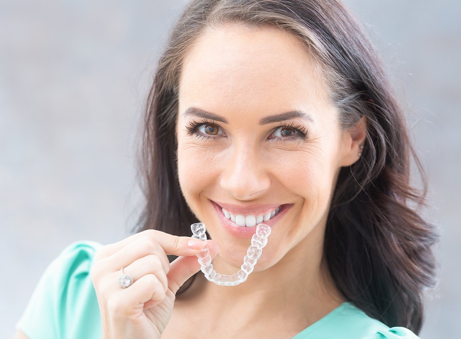 Woman placing Clear Correct tray