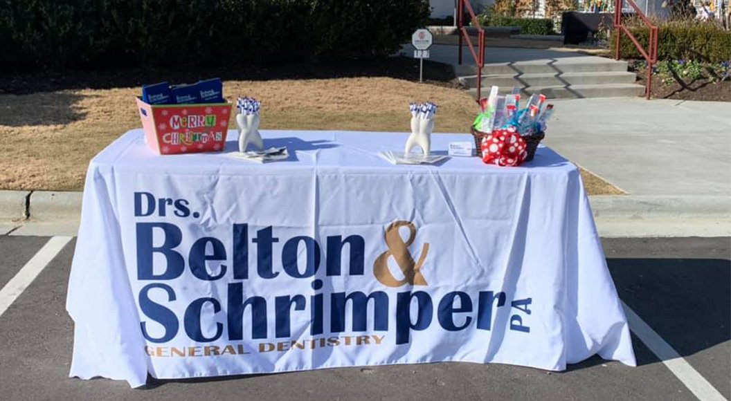 Dental office information table at Christmas event