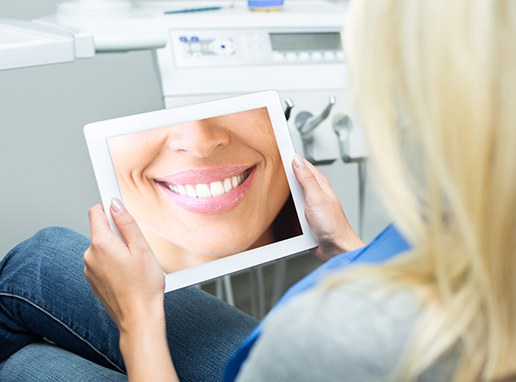 Woman looking at digital imaging on tablet computer screen