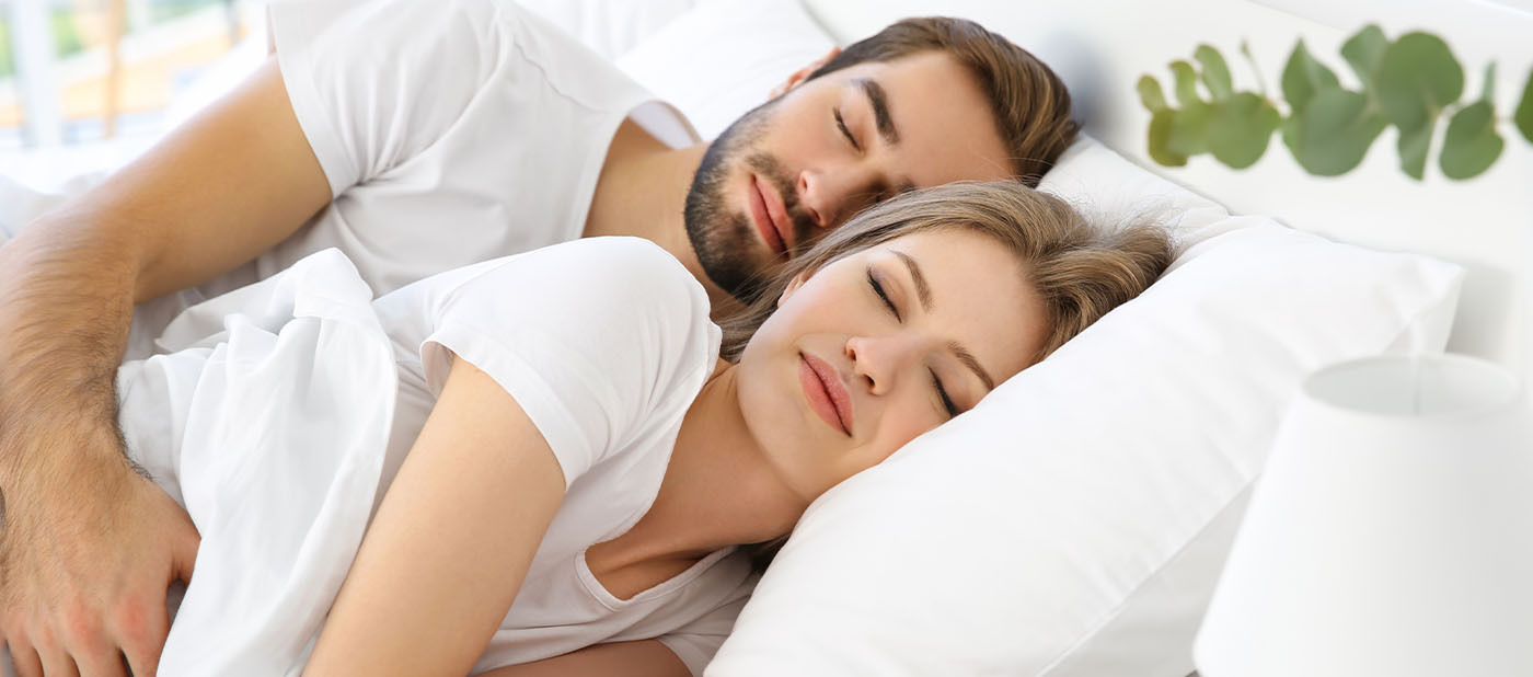 Man and woman sleeping soundly together