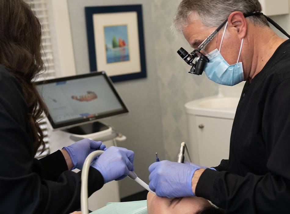 Dentist treating dental patient