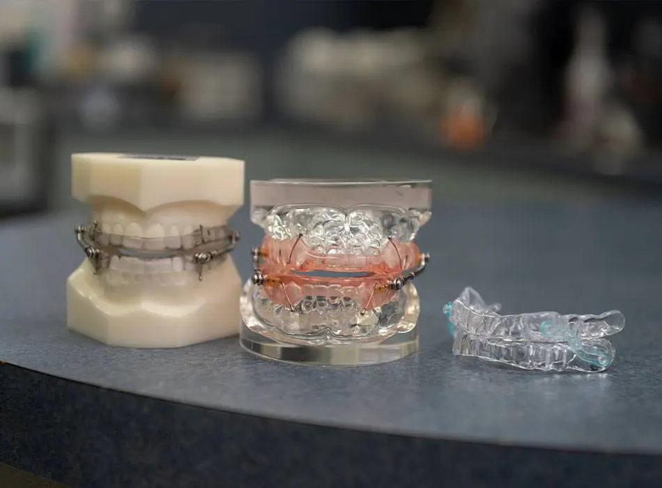 Model smiles with sleep apnea treatment oral appliances