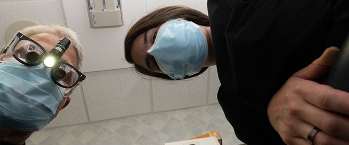 Patient's view of dentist and team member looking down