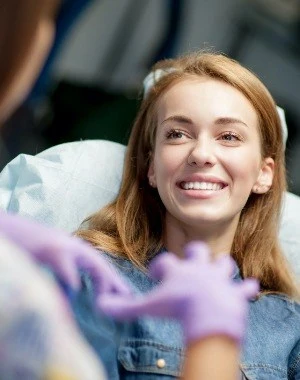 Smiling woman in dental chair