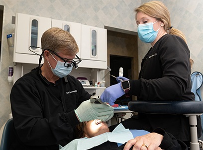 Dentist completing porcelain inlay and onlay treatment