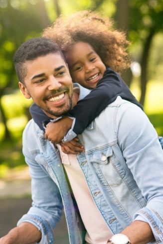 Smiling father and daughter