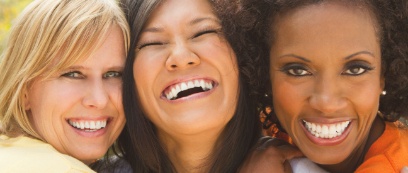 Three women with gorgeous smiles after cosmetic dentistry