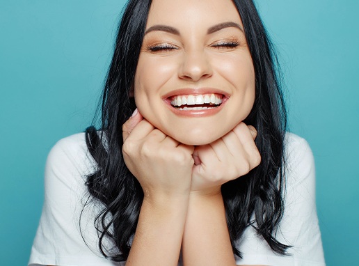 Woman showing off smile after makeover