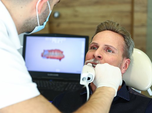 Dentist capturing digital bite impressions