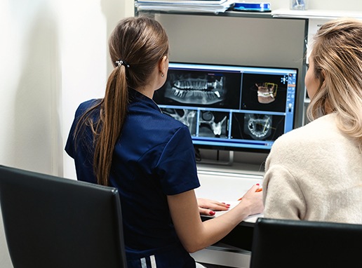 Dental team members reviewing digital dental x-rays