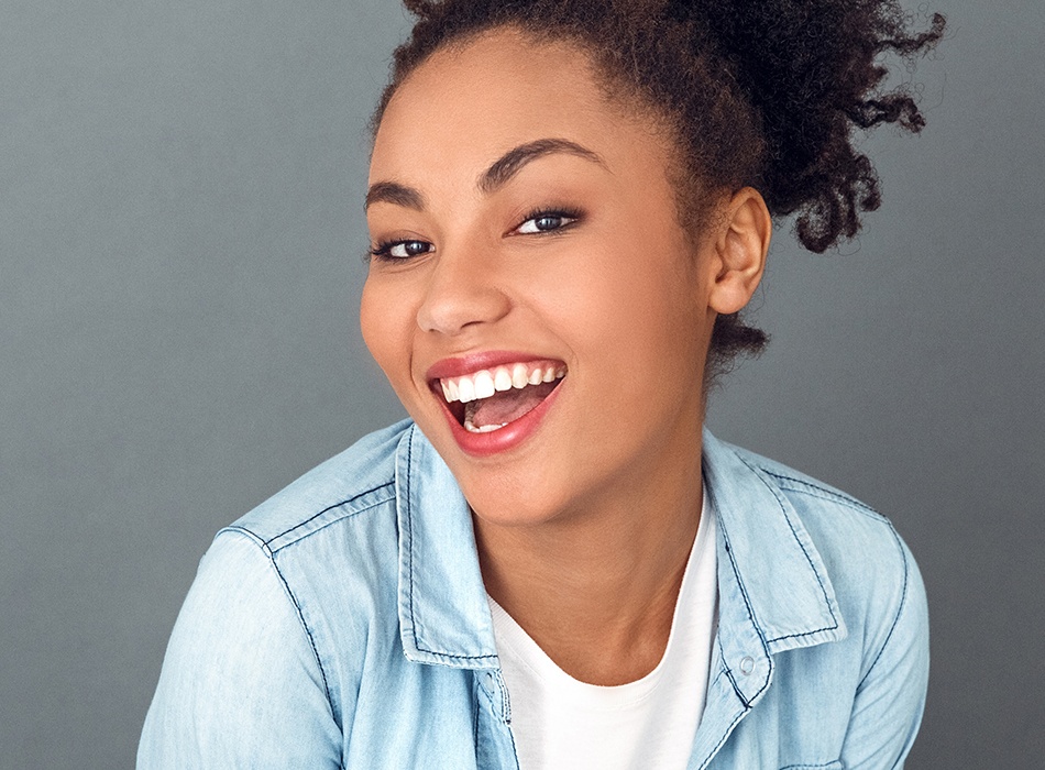 Woman with bright smile after teeth whitening