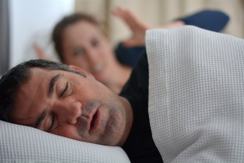 man suffering from sleep apnea 