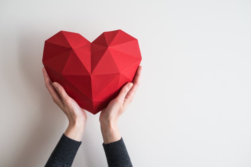 Dentist in Mount Rocky holding a paper heart